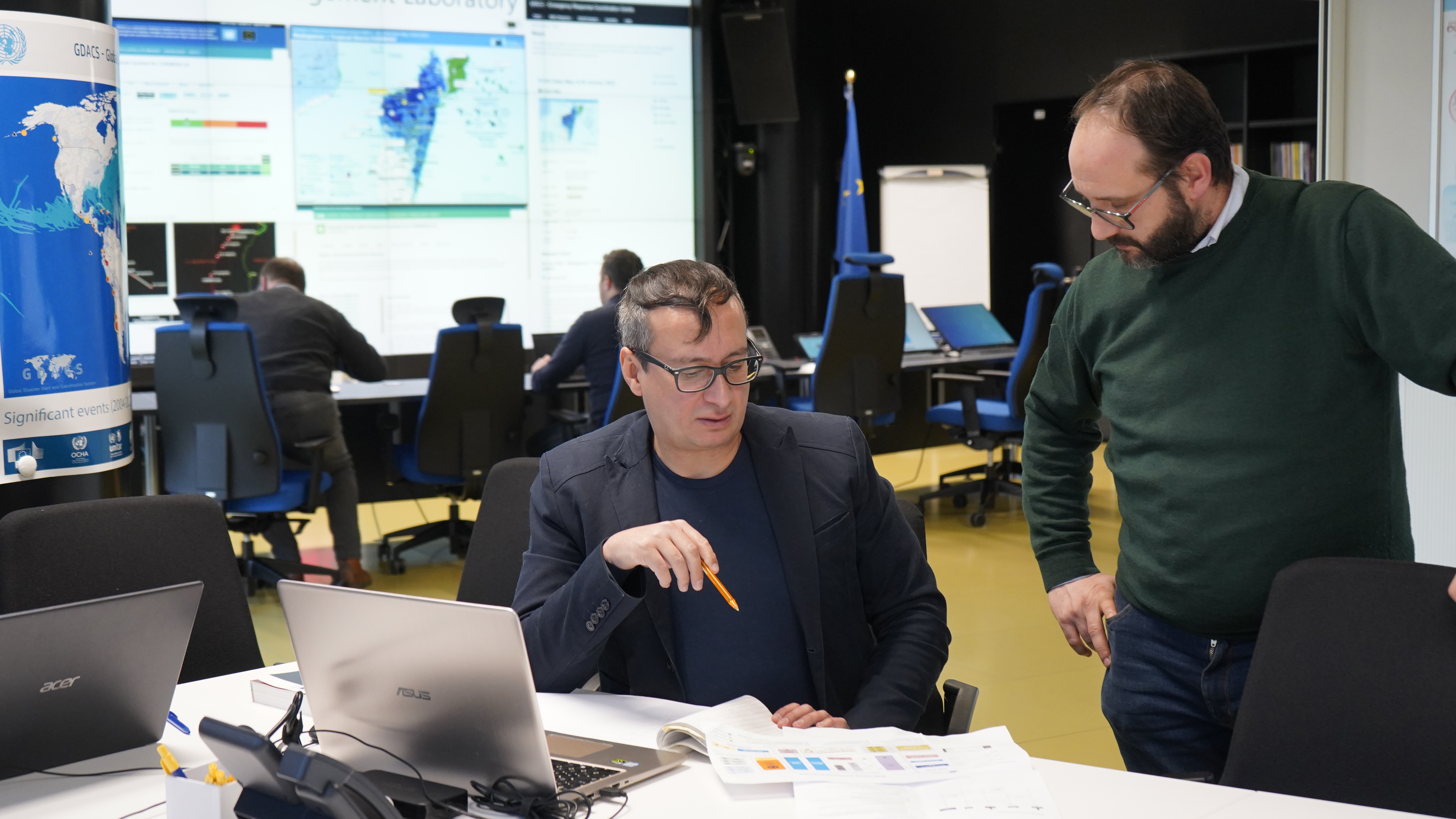 Two researchers working at the European Crisis Management Laboratory