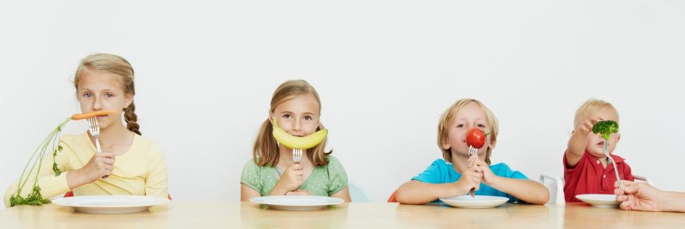Corbis_42-52290962_Children sitting at table with vegetables.jpg