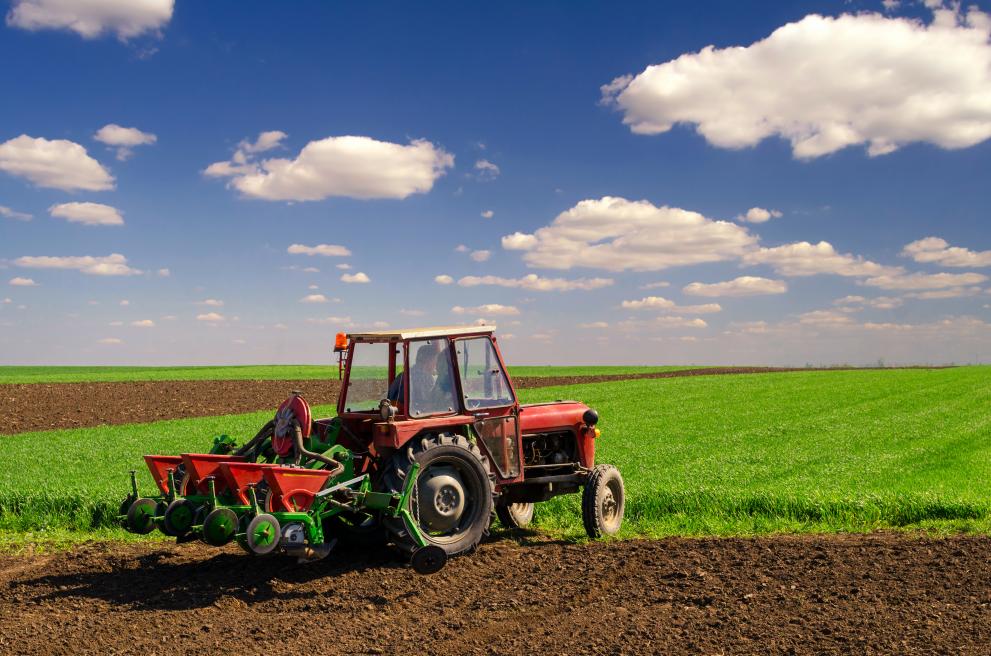farmer_with_tractor_sowing_on_agricultural_fields_on_sunny_spring_day_c_adobestock_by_prudkov_108346642.jpeg