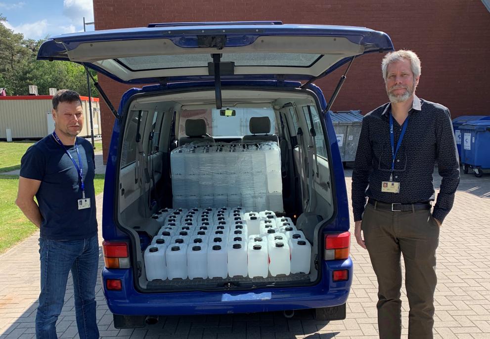 Hand sanitising gel is ready for delivery. From left to right John Seghers and Håkan Emteborg, Joint Research Centre, Geel