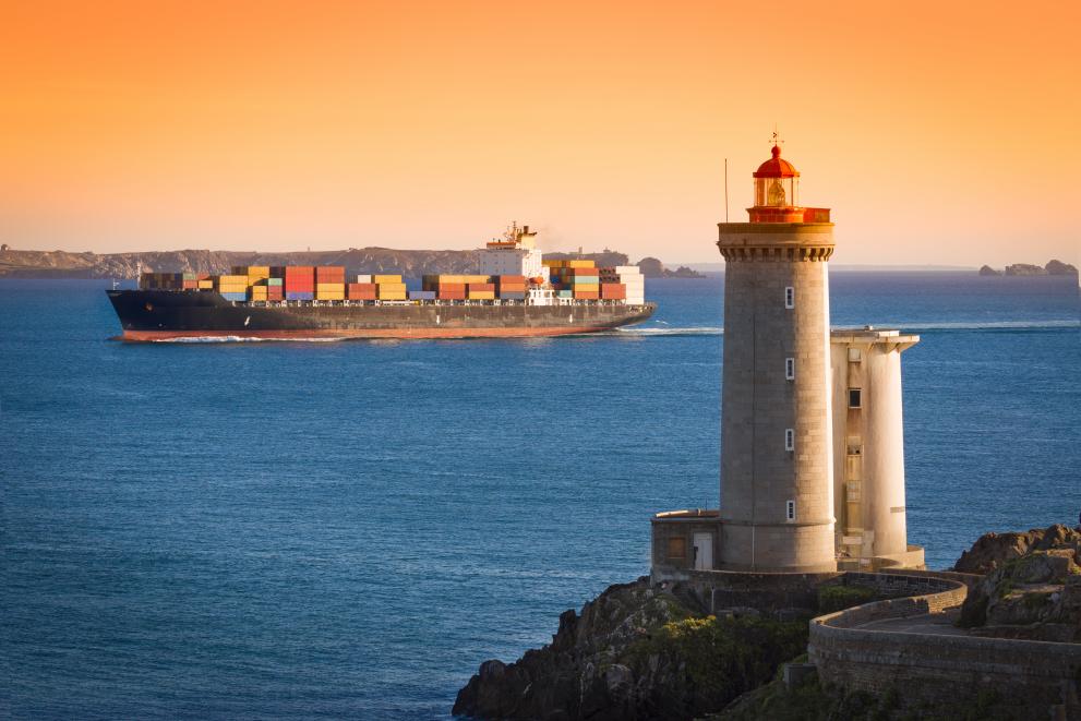 Lighthouse and container ship.