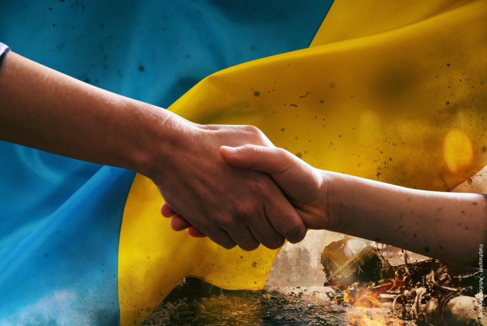 a handshake with the Ukraine's flag in the background