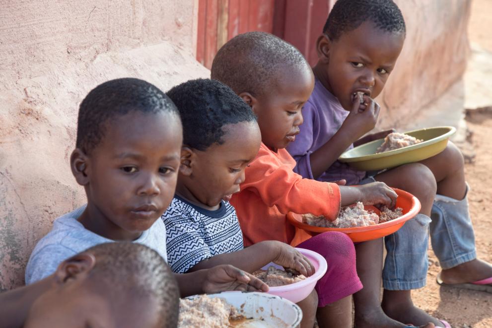 Image of kids eating rice