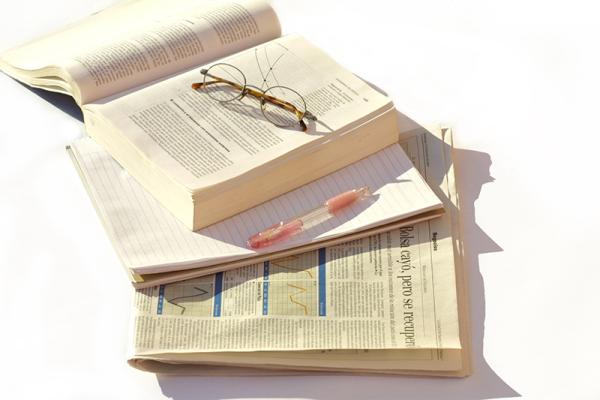 Eyeglasses lying on an open book