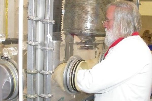 Roger Eykens preparing 235UF4 deposits by physical vapour deposition