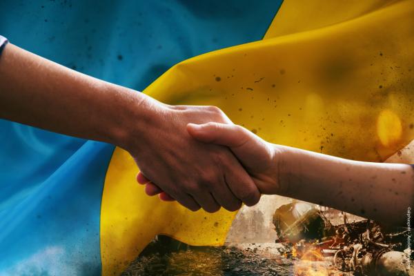 a handshake with the Ukraine's flag in the background